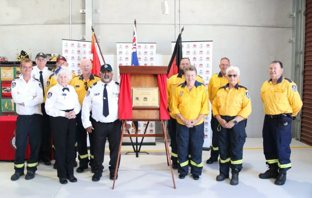 HAPPY: Karuah Rural Fire Brigade members celebrating the official opening of their new station on November 14. Picture: Paul Mulvaney