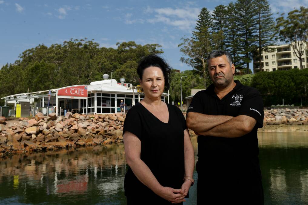 LOSSES: Dolphin Watch Cafe manager Eser Dinkciler, right, and staff member Tracy Blundell. Picture: Jonathan Carroll