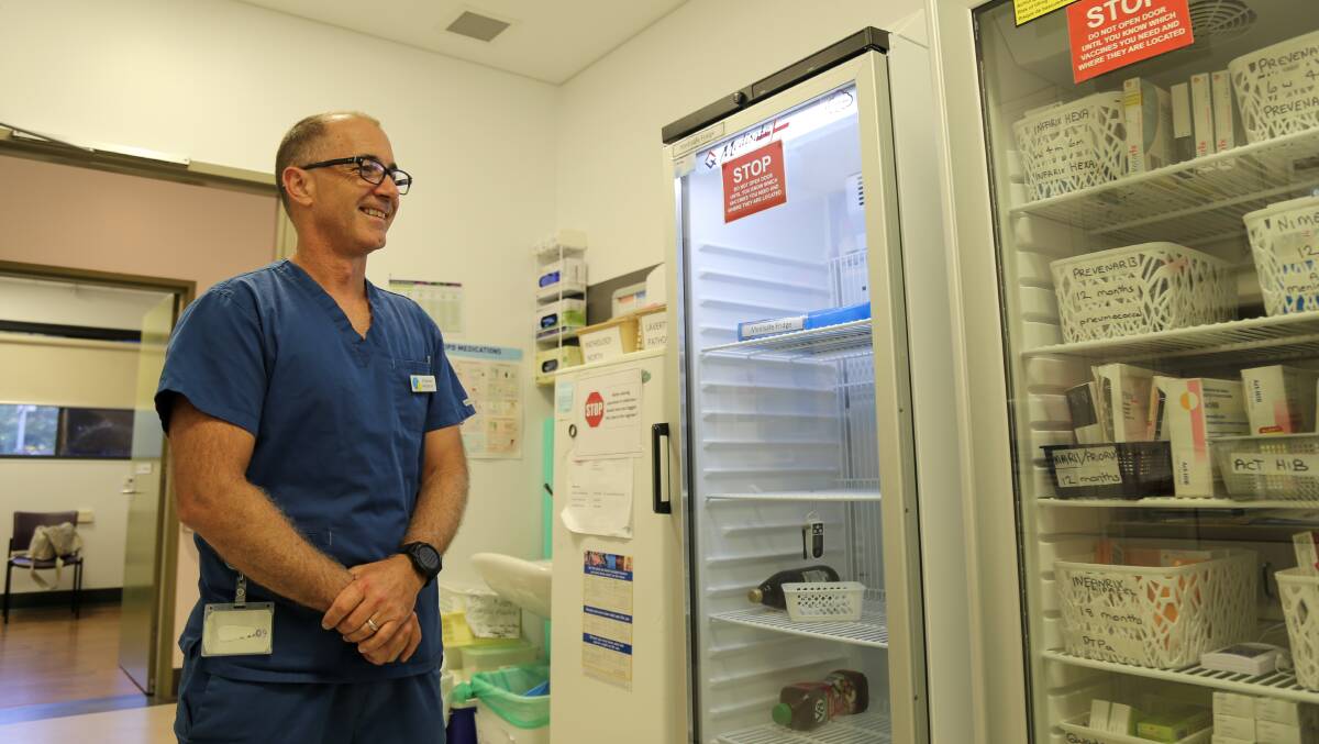 NEW PHASE: Dr Damian Welbourne next to one of Raymond Terrace Family Practice's new vaccine fridges that was bought to store the COVID-19 vaccine, which it is expecting to receive this week. Pictures: Ellie-Marie Watts