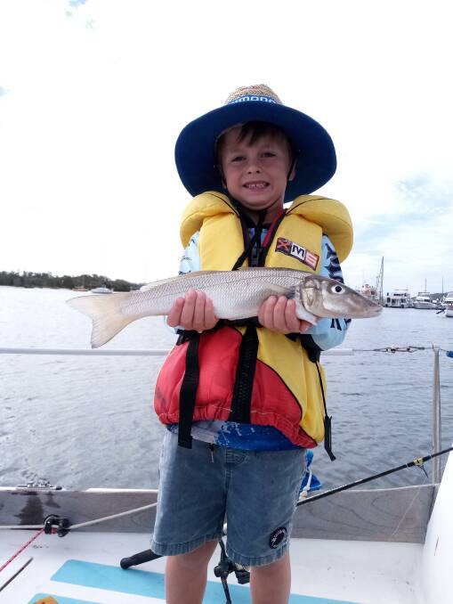 HAPPY: Young Hayden Ballard, aged 5, with his first fish. Now he is hooked.