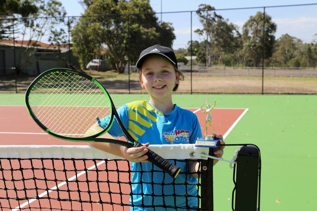 Olivia McLoughlin, 10, on the new hardcourt at the Mallabula tennis centre. Olivia won her age group's singles girls championship in the Port Stephens 2021 Foreshore Tennis interclub tournament.