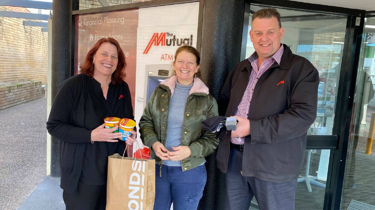 HERE TO HELP: Port Stephens Family and Neighbourhood Services assistant manager Ann Fletcher (centre) with Mutual Bank Raymond Terrace member service supervisor Melissa Osborn and business banking manager Scott Pulbrook.