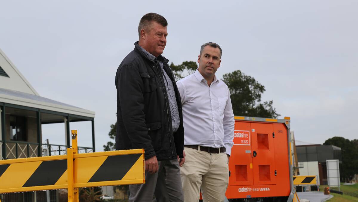 Port Stephens Council's group manager of facilities and services, Greg Kable, and Mayor Ryan Palmer at the Raymond Terrace levee on Monday, July 11, 2022. Picture: Ellie-Marie Watts