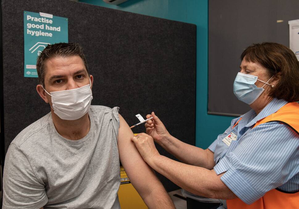 GET THE JAB: Hunter New England Health nurse Wendy Aston gives resident Clayton Hickey a COVID-19 vaccination. Picture: Supplied