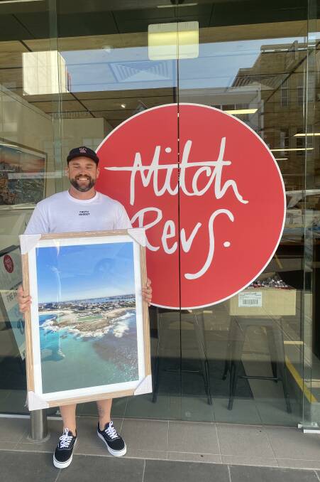 SUPPORT: Matt Richards sells his photos out of Mitch Revs Gallery in Newcastle. He is raffling a frame photo to raise funds for Lifeline during Mental Health Month.