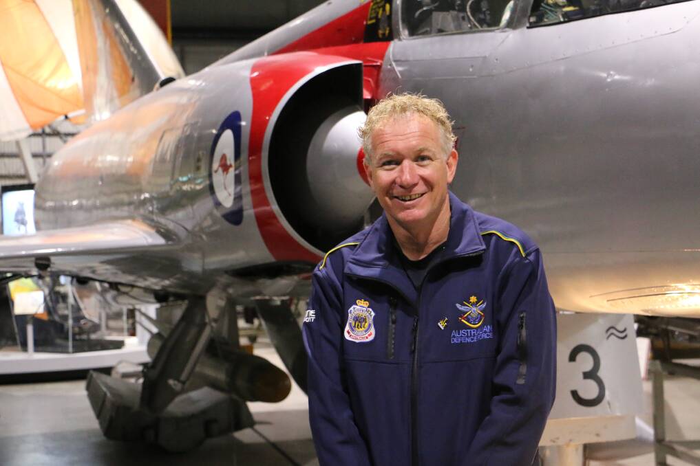 "I joined the air force when I was 16. It's all I've ever done. I started off working on aircraft, on this one (behind him), a Mirage. It shows how old I am, they're in museums now." - Squadron Leader Danny Jeffery at Fighter World in Williamtown. Picture: Ellie-Marie Watts