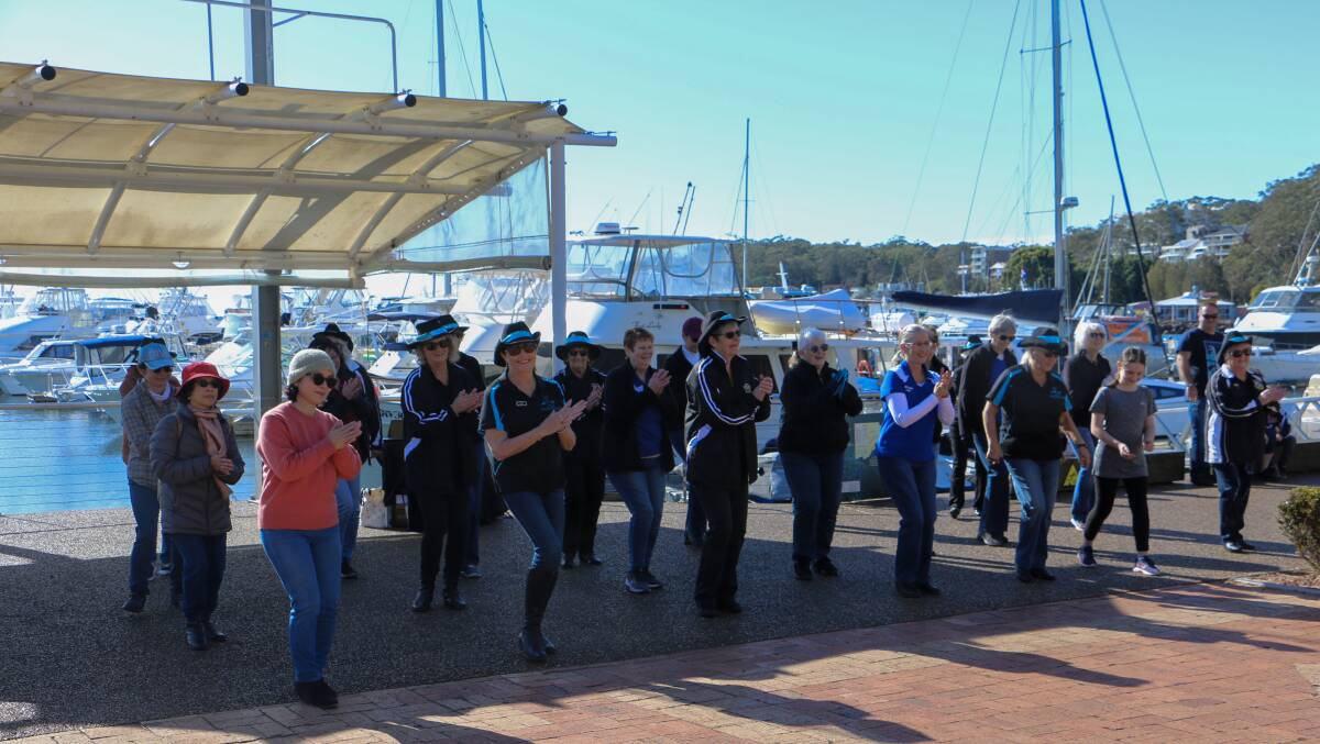 Line dancers in action at d'Albora Marina, Nelson Bay on Monday morning.