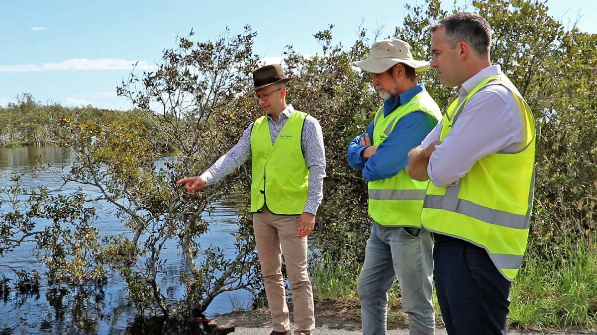 CASH FOR PROJECTS: Port Stephens Council employees John Maretich and Michael Osbourne survey storm damage with Mayor Ryan Palmer at the Foreshore Drive culvert in Corlette. Picture: Supplied