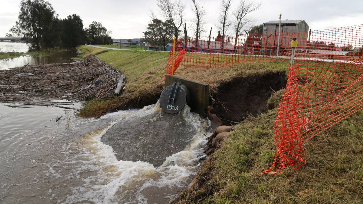 The Kangaroo Street pump on Monday, July 11, 2022. Picture also shows a partial collapse of the Raymond Terrace levee. Picture: Ellie-Marie Watts