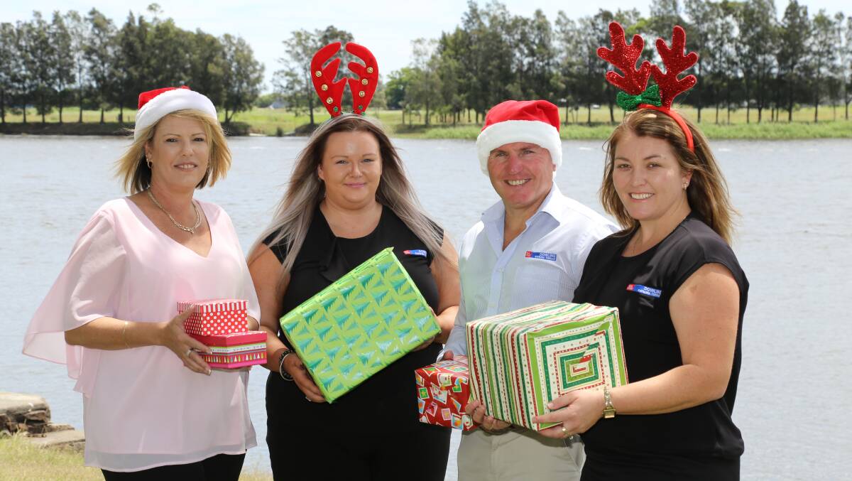FESTIVE: The Examiner's Tracey Marjoram with Caitlyn Vinton, Craig Higgins and Michelle Bink from Dowling Real Estate. 