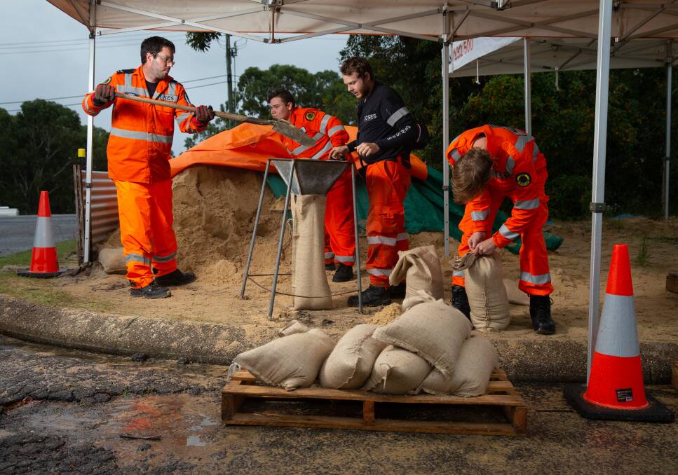 DIG IN: Port Stephens SES volunteers filling sandbags in Raymond Terrace on Friday, March 19. Pictured, from left, is Jason Lichtwark, Zayne Phillips, Aidan Coulter and Levi Lewis. Picture: Marina Neil