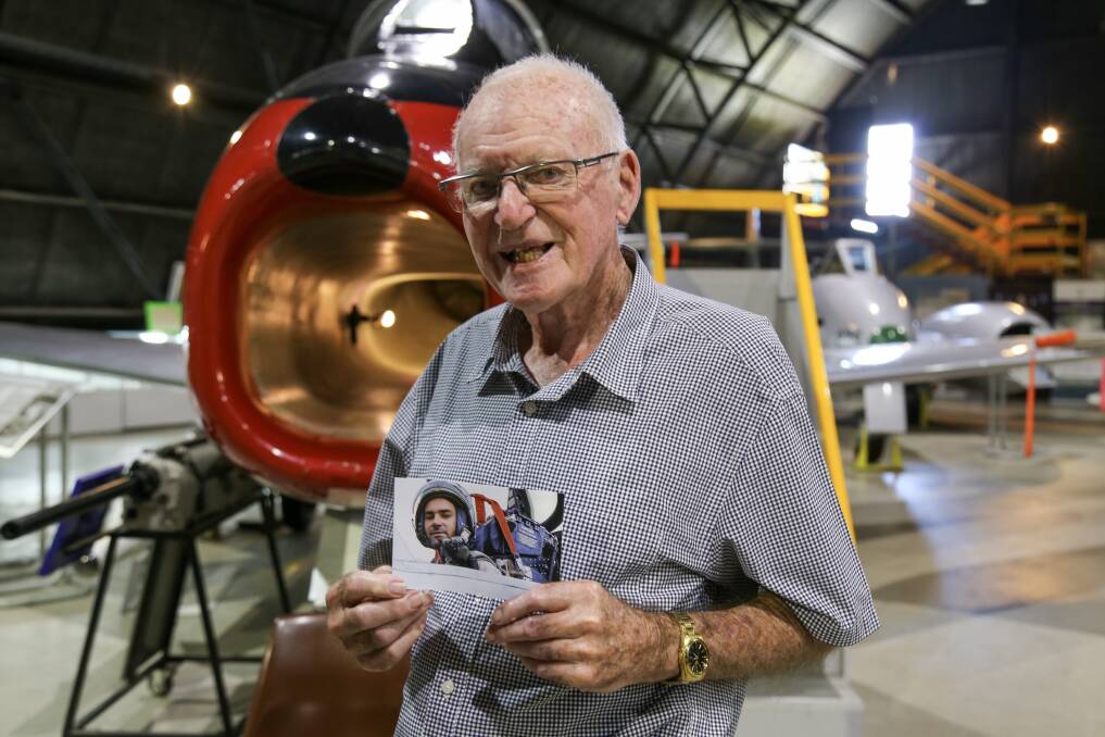 HISTORY: Veteran RAAF fighter pilot Don Newton holding a picture of himself, taken in 1958, at Fighter World. Mr Newton, 68, flew the aviation museums two Sabre jets. Picture: Ellie-Marie Watts