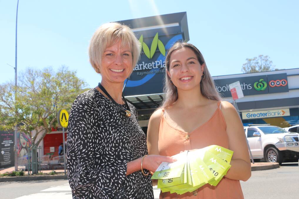 WINNER: Nakkitah Leard, 16, from Medowie, is presented with the $1000 in gift vouchers from MarketPlace Raymond Terrace centre and marketing manager Colleen Mulholland-Ruiz. Miss Leard won the Examiner's 2019 Annual Business Awards voter prize.