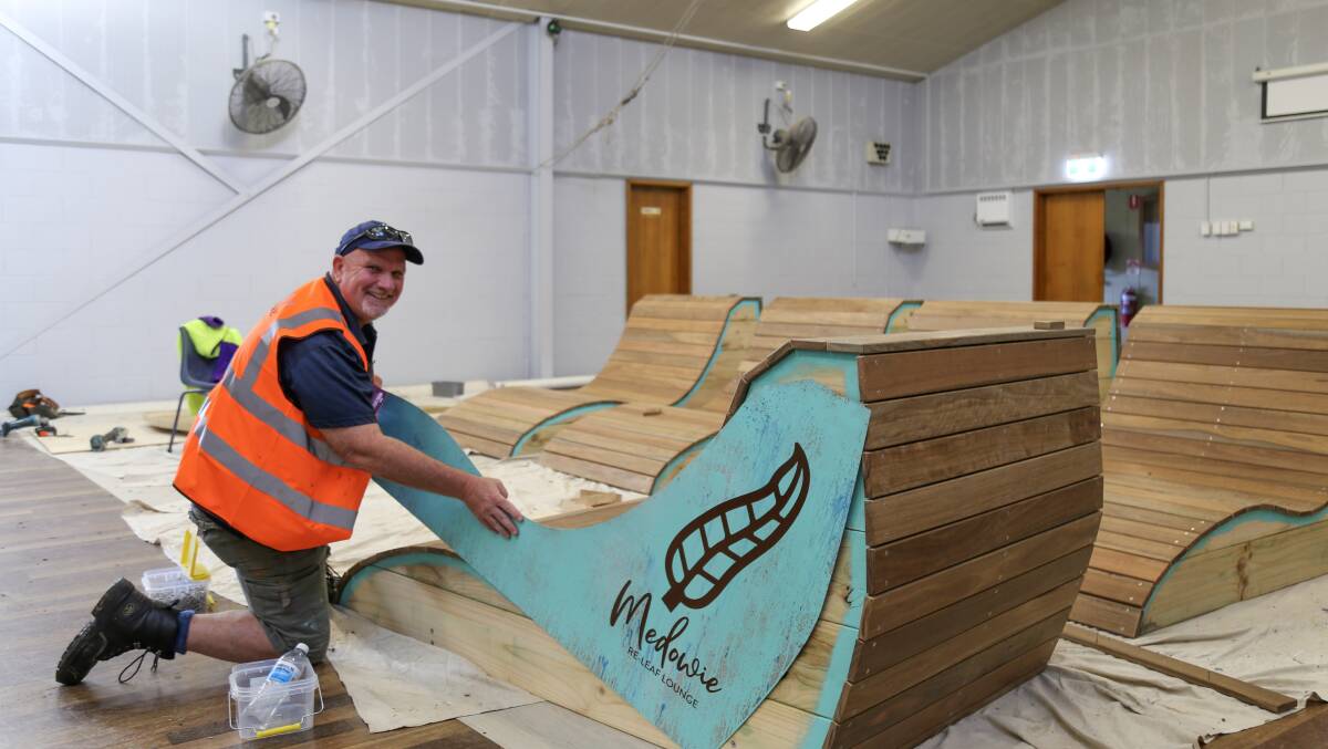 Chris Doohan putting together the re-leaf-chairs in the Medowie community hall on Friday. Picture: Ellie-Marie Watts