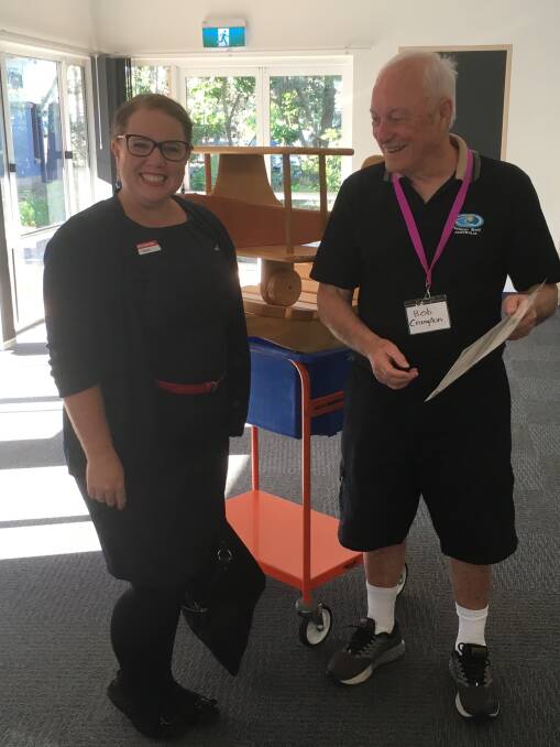 Raffle winner Kylie Stone with Bob Crampton, president of Tomaree Parkinson's Support Group.