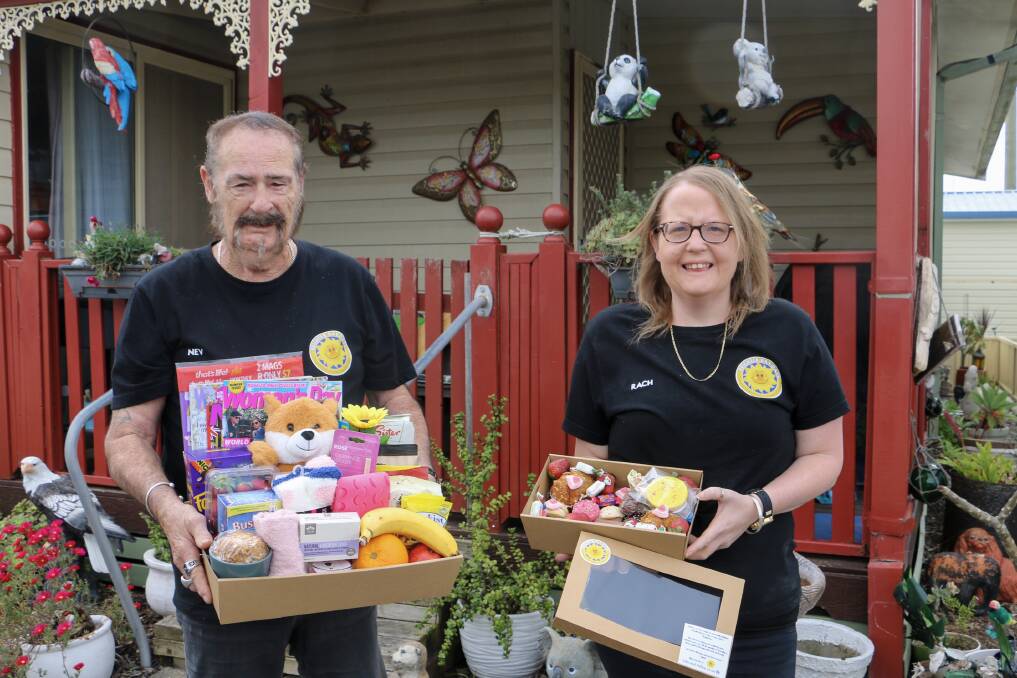 Neville and Rachael McDermott with some of their Brighter Bay Days boxes which are delivered across Port Stephens.