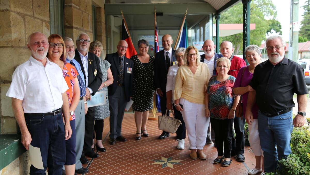 Paterson MP Meryl Swanson, centre, with veterans who received certificates and their families. Picture: Ellie-Marie Watts