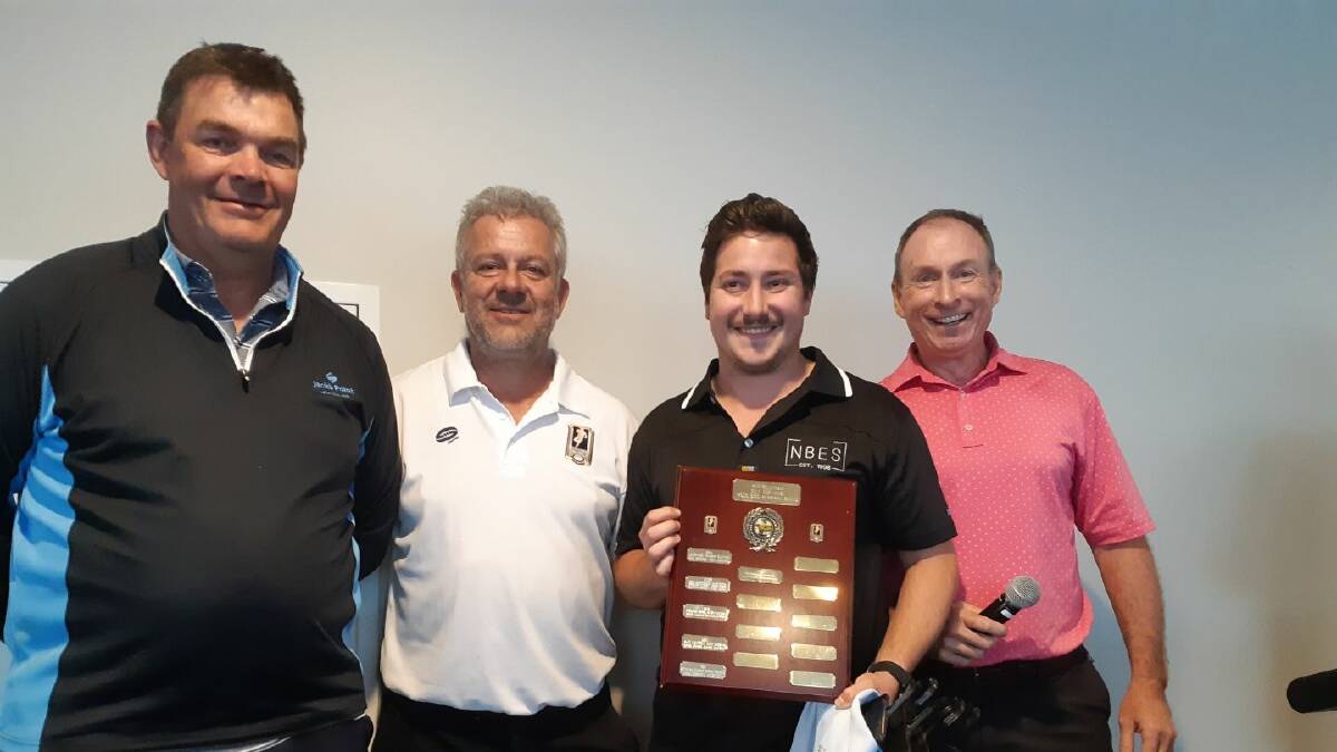 Paul Dunn, left, presenting the Ross Grigg shield to the Port Stephens Men of League's golf day winners.