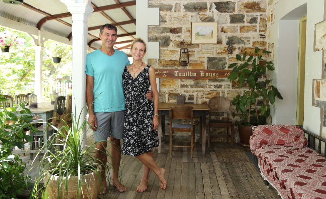 RESTORATION: Tanilba House's new owners Glenn Short and Deidre Hall on the verandah of the state heritage listed property located in Creswell Crescent, Tanilba Bay. Pictures: Ellie-Marie Watts