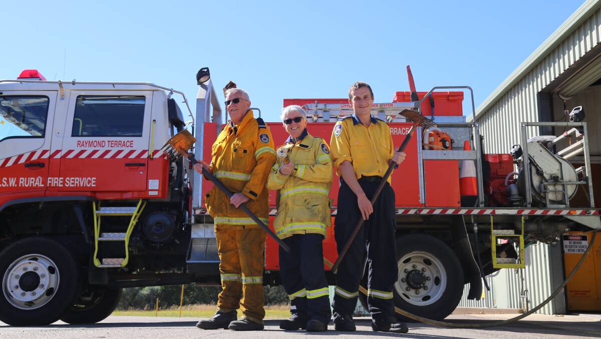 PREPARED: Raymond Terrace RFS deputy captains Dallas Green and Nick Pearson with firefighter Gina Farraway.