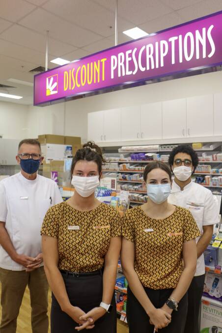 NO RATS: Nelson Bay Discount store pharmacist Mark Shaw (left) with staff Lauren, Katie and Yahya.