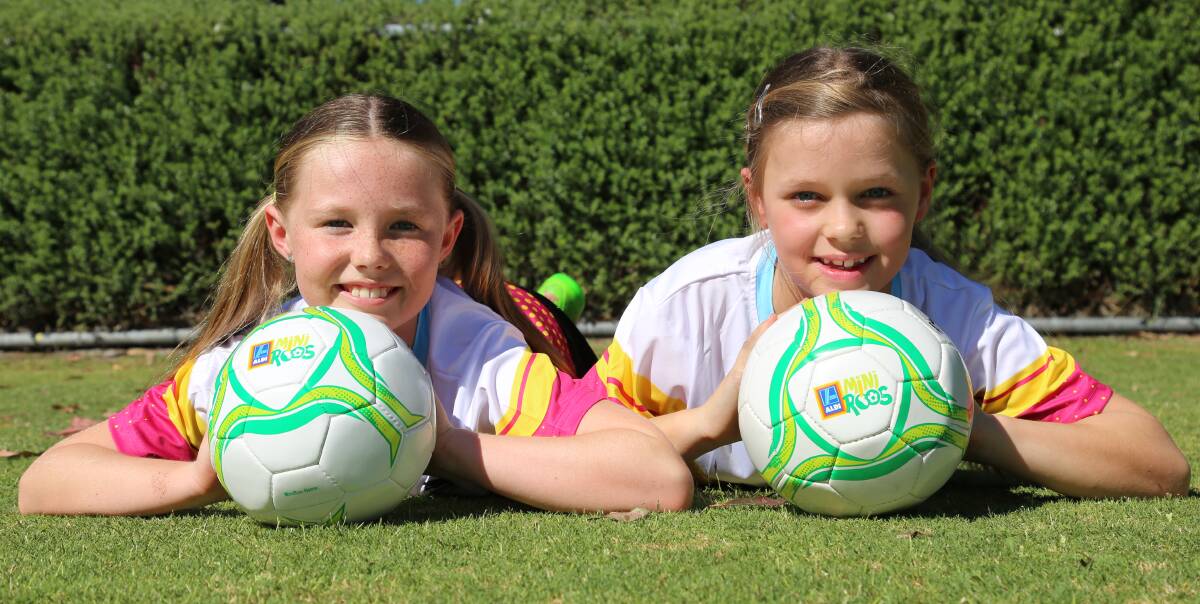 LEARNING: Chloe Shaw, 8, and Sarah Patmore, 8, says they are excited to start the ALDI MiniRoos Kick-Off For Girls summer program, which starts in Nelson Bay this week. Picture: Ellie-Marie Watts
