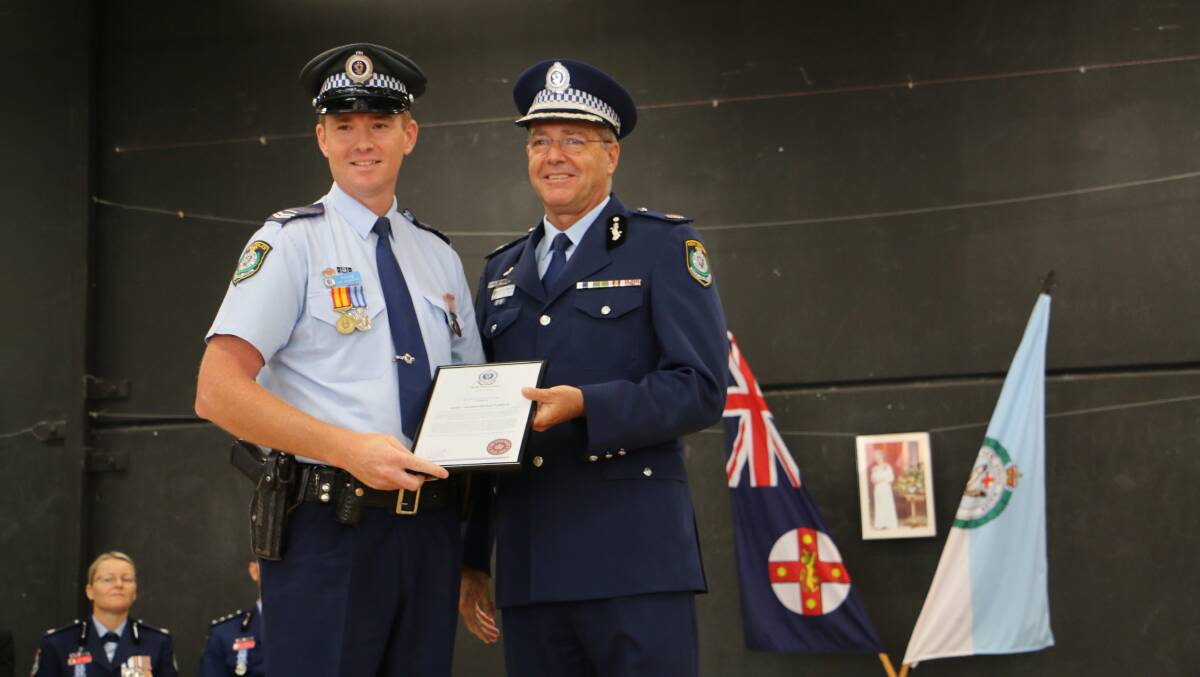 Senior Constable Mitch Parker with Assistant Commissioner Max Mitchell APM.