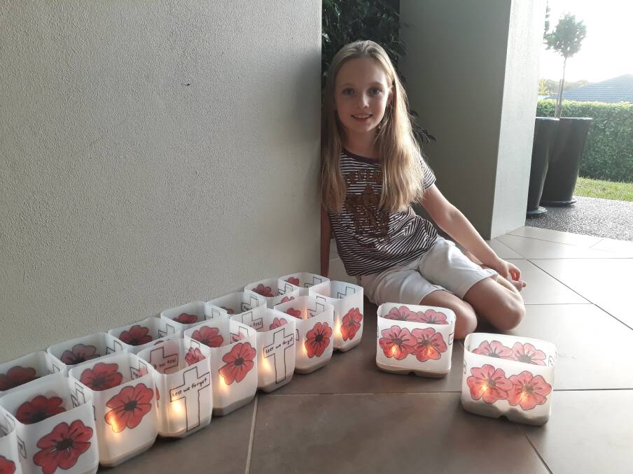 Sarah Lyon, 11, with her Anzac Day lanterns. Picture: Supplied