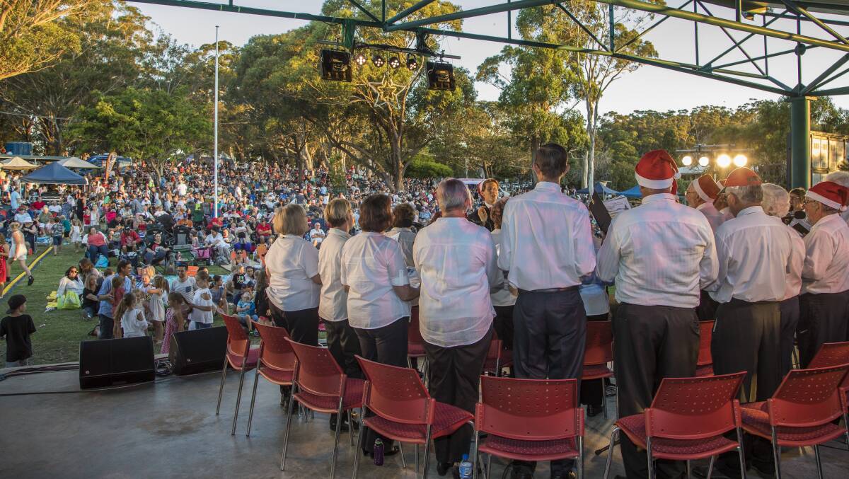 The SeaSide Singers performing to a packed Fly Point Park during last year's carols. Picture: Henk Tobbe