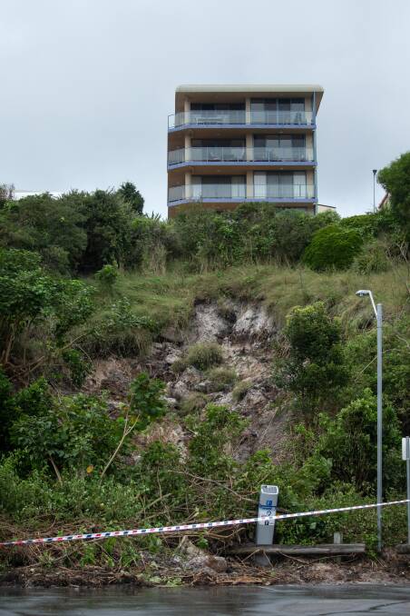 Image shows the landslip in Teramby Road, opposite Nelson Bay Fish Market, in the days after it occurred mid-March. Picture: Marina Neil