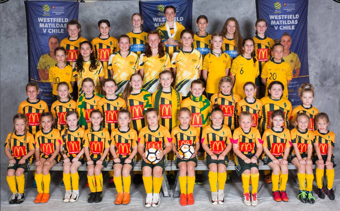 IN IT TOGETHER: Raymond Terrace Soccer Club's junior female players. Some are wearing their Matildas colours to show their support for the Women's World Cup. Picture: Supplied