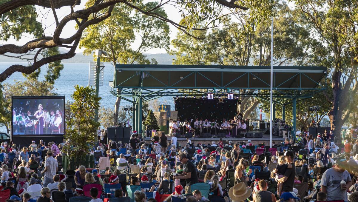 CHEERY: Carols at the Bay in 2017. The annual community carols event will return to Fly Point on Sunday, December 15. Picture: Henk Tobbe