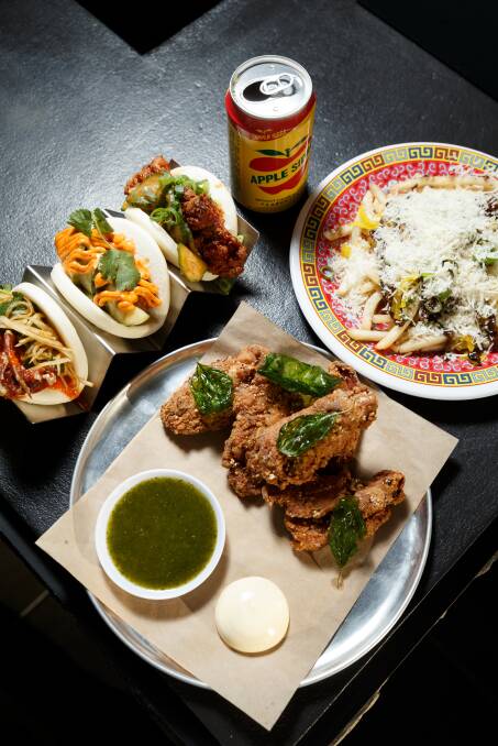 Picture shows some of the food Taiwanese food truck Bao Brothers have on offer: Shoestring fries with pickled daikon, porcini, black garlic and parmesan; a trio of bao buns; chicken ribs; and a can of Taiwanese apple soda. Picture: Max Mason-Hubers 