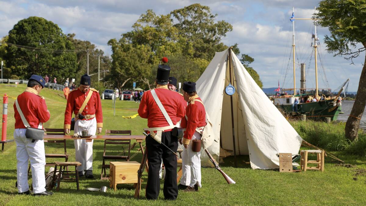 The 40th Regiment of Foot on Raymond Terrace riverfront on Saturday for the Step Back Into King Street Heritage Festival. Behind them is the William the Fourth replica ship.