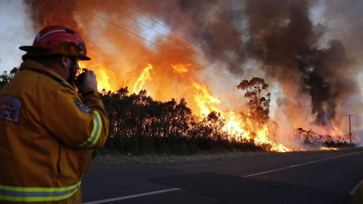 The RFS responding to the Tilligerry bushfire in August. Picture: AAP Image/Darren Pateman
