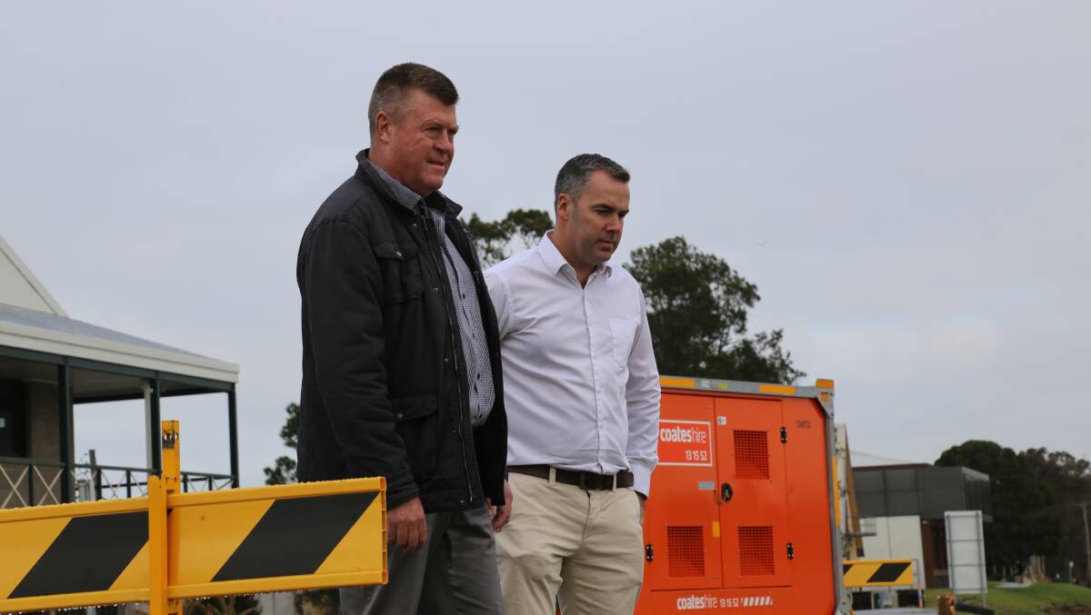 Port Stephens Council's group manager of facilities and services, Greg Kable, and Mayor Ryan Palmer at the Raymond Terrace levee on Monday, July 11, 2022 following flooding in the LGA. Picture: Ellie-Marie Watts