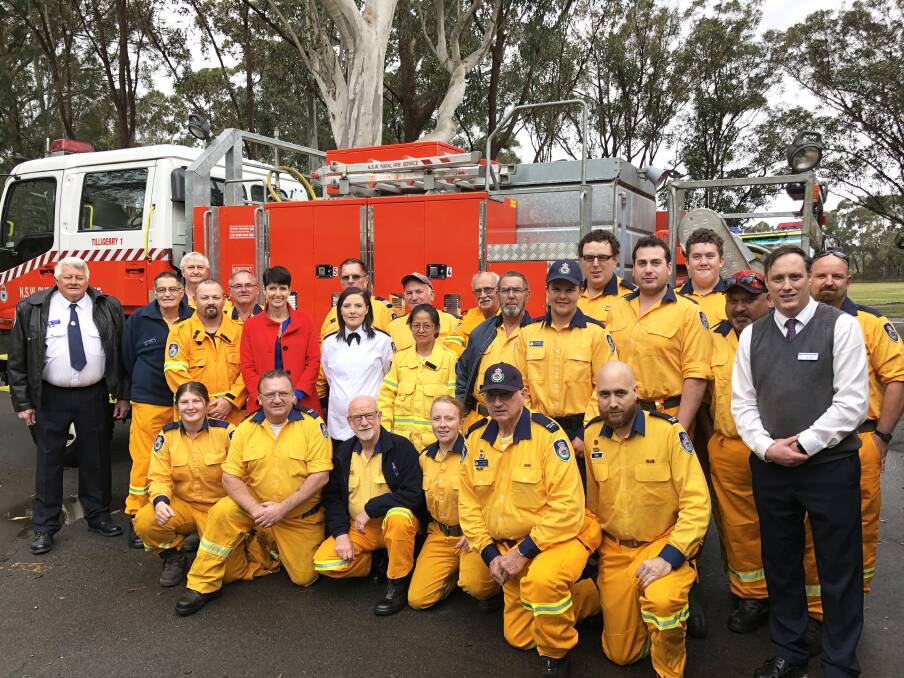 THANKS: Port Stephens MP Kate Washington (in red) with Tilligerry Rural Fire Brigade. Picture: Supplied