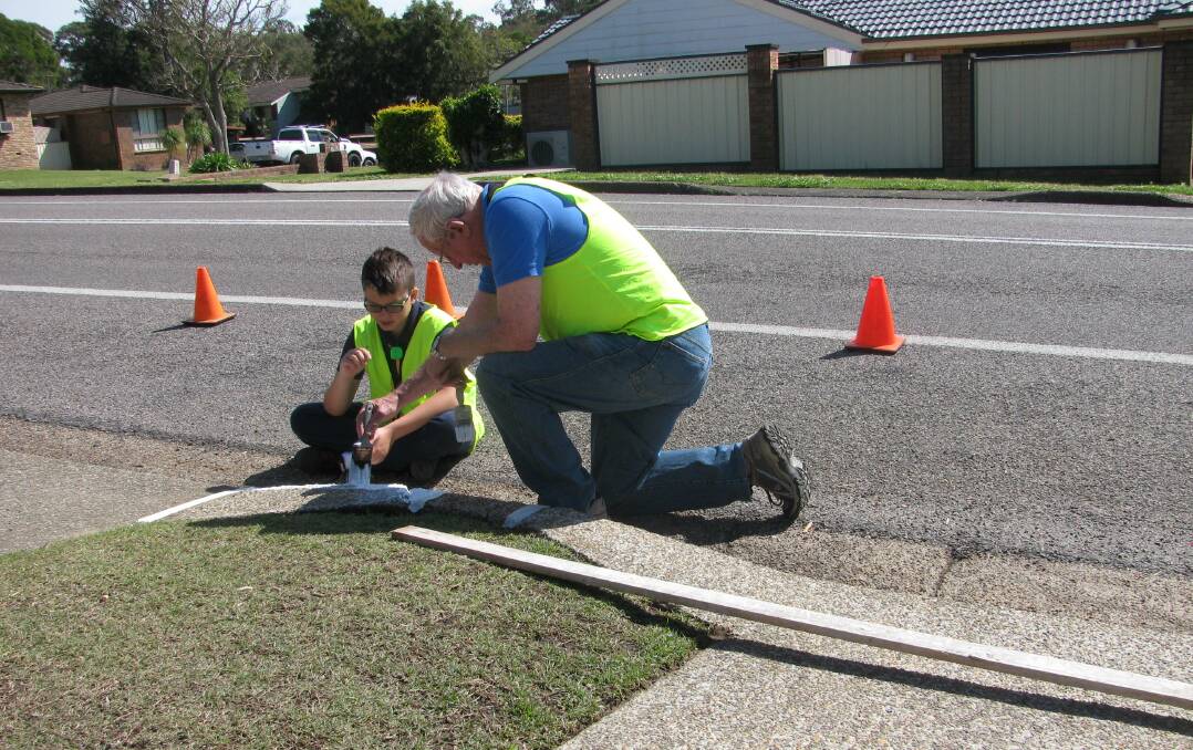 Scouts in Benjamin Lee Drive, Raymond Terrace to paint driveways.