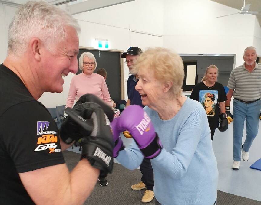 FRIENDLY: Port Stephens Parkinson's Support Group member Fay Crampton, 79, exercising and having fun with son David. 