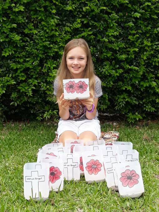 Corlette resident Sarah Lyon, 11, has been making lanterns for her neighbours to display at the end their driveways on Anzac Day. Picture: Rod Lyon