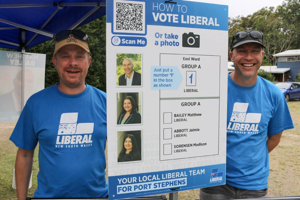 Liberal candidate for east ward Matt Bailey (right) with Rob Boucher at the Salamander Bay voting booth on Saturday, December 4.