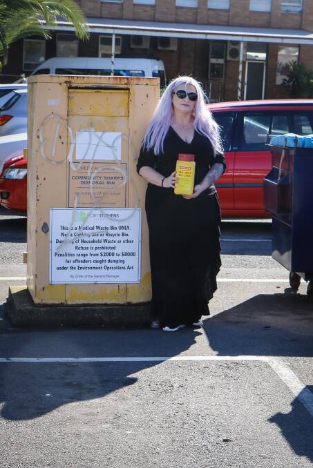 A DISGRACE: Raymond Terrace's Rekell Sullivan near the poorly maintained sharps disposal bin which she says is often mistaken for a clothes recycling bin.