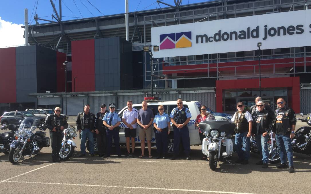 TEAM: Old Boars Motorcycle Club members with Chief Inspector Tony Townsend, Mark Hughes, Dave Hanna, Senior Constables Brearne Callaghan and Trent Moffat and Susie Slade in Newcastle on April 24.