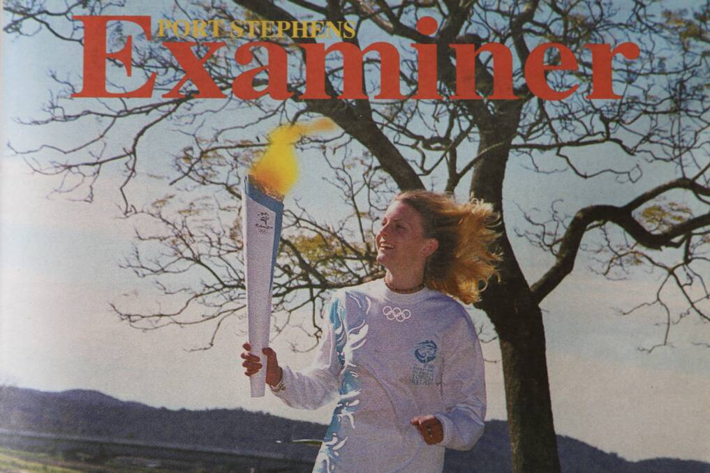 MOMENTOUS: Katie Turrell (nee Hall) as a 19 year old holding the Olympic torch on the front page of the August 16, 2000 edition of the Examiner.