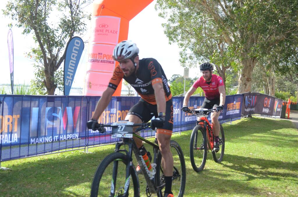 LEFT OUT: Port Stephens has been the opening stage of Port to Port MTB since 2013. Picture of riders crossing the finish line in 2017. Picture: Sam Norris