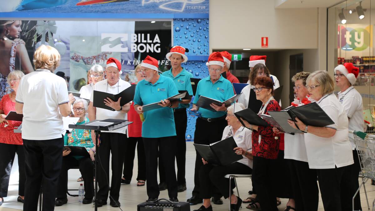 The SeaSide Singers performing carols at the launch of the Kmart Wishing Tree Appeal in Salamander Bay on November 15. Picture: Ellie-Marie Watts