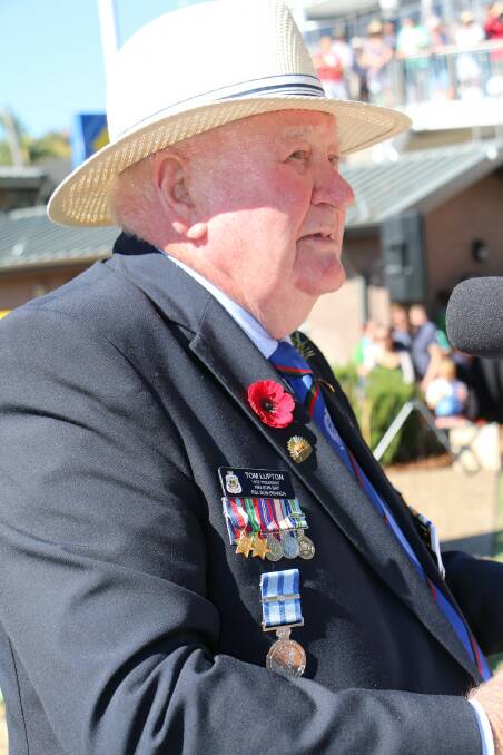 LEST WE FORGET: Nelson Bay RSL Sub-Branch vice president Tom Lupton pictured emceeing last year's Anzac Day mid-morning service.