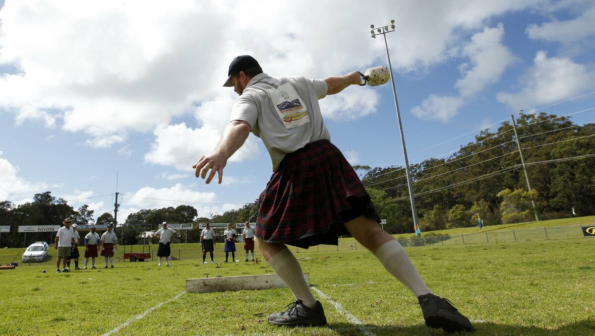CHUCK IT: A competitor throws a stone in the strong man competition at the 2015 Clans on the Coast Celtic Festival at Tomaree Sporting Complex, Nelson Bay. Picture: MAX MASON-HUBERS 