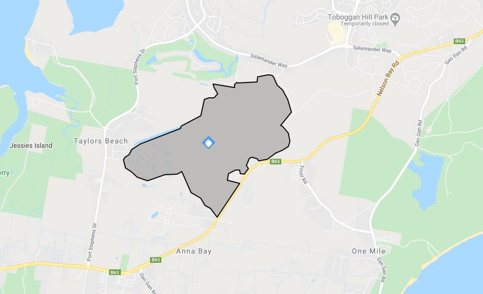 A snapshot of the fire-affected area in Taylors Beach taken 2.30pm on Monday from the NSW RFS Fires Near Me website. The fire has burned about 250 hectares of bush within Nelson Bay Road, Port Stephens Drive and Salamander Way.
