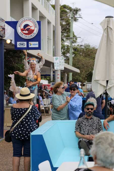 Customers enjoying live music and entertainment at the parklet in Shoal Bay Road on Thursday. Picture: Ellie-Marie Watts